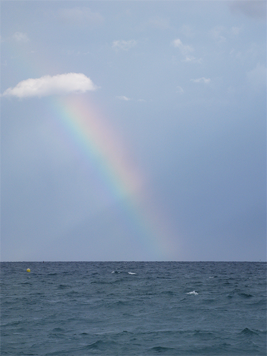 Rainbow by the sea of Barcelona, Spain.