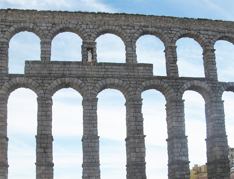 Zoomed out view of the Roman Aqueduct located in Segovia, Spain.