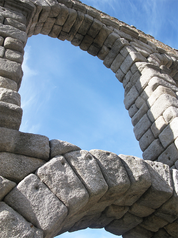 Upclose of the Roman Aqueduct located in Segovia, Spain.
