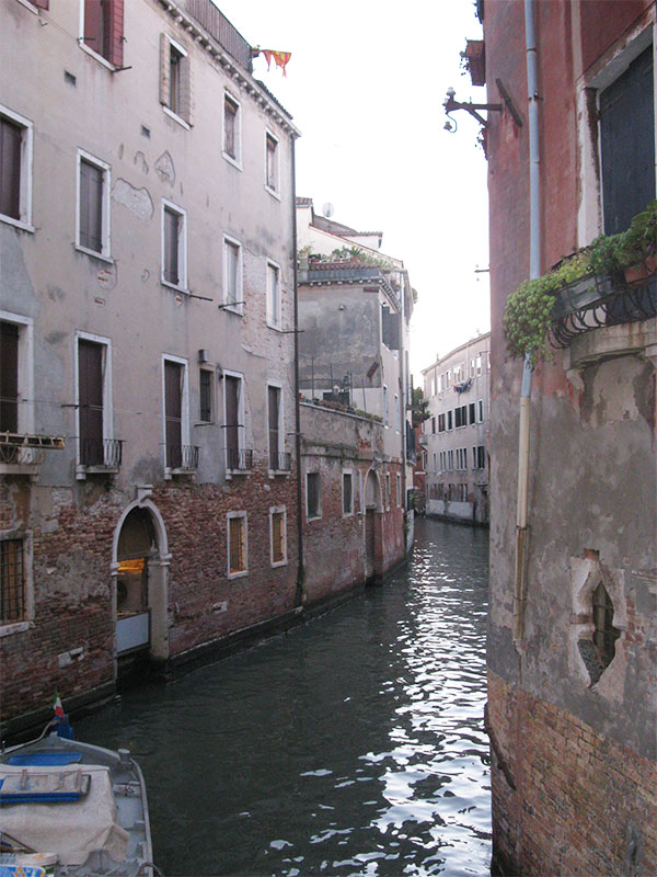 Water canal running between buildings in Venice, Italy.