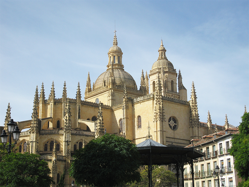 A stunning yellow Gothic cathedral in Segovia, Spain.